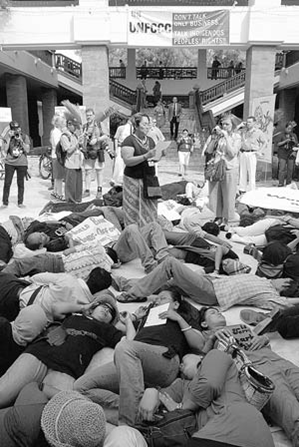 People's movements stage a die-in at the Bali climate change negotiations - The Bali declaration on climate justice is created.